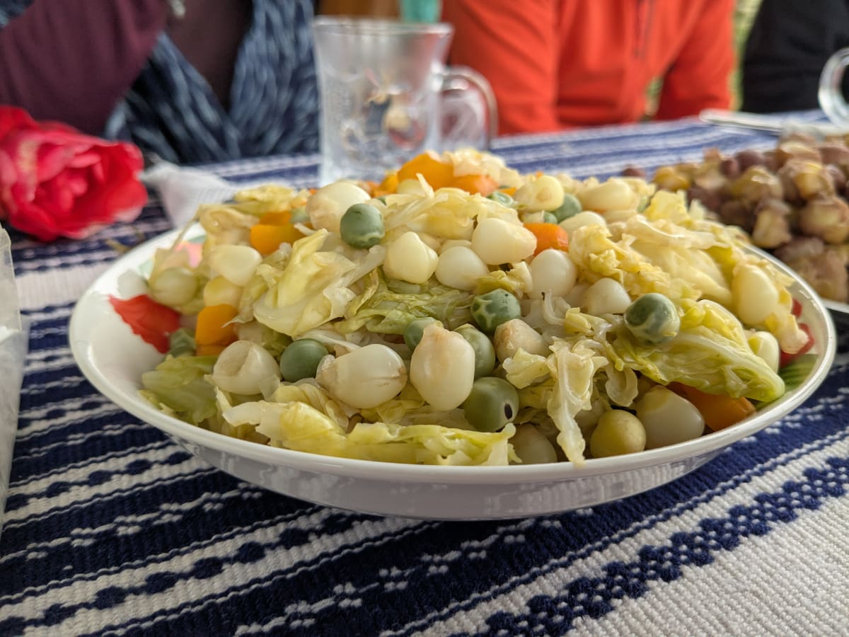 A local dish to Cuemal, Peru of cabbage, peas, corn, and other vegetables.